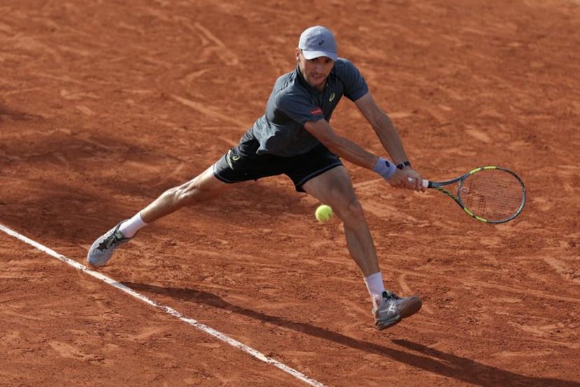 Belgium's Raphael Collignon plays a backhand return to Italy's Matteo Arnaldi during their men's singles match on day 7 of the French Open tennis tournament at the Roland-Garros Complex in Paris on May 30, 2026.  Thomas SAMSON / AFP
