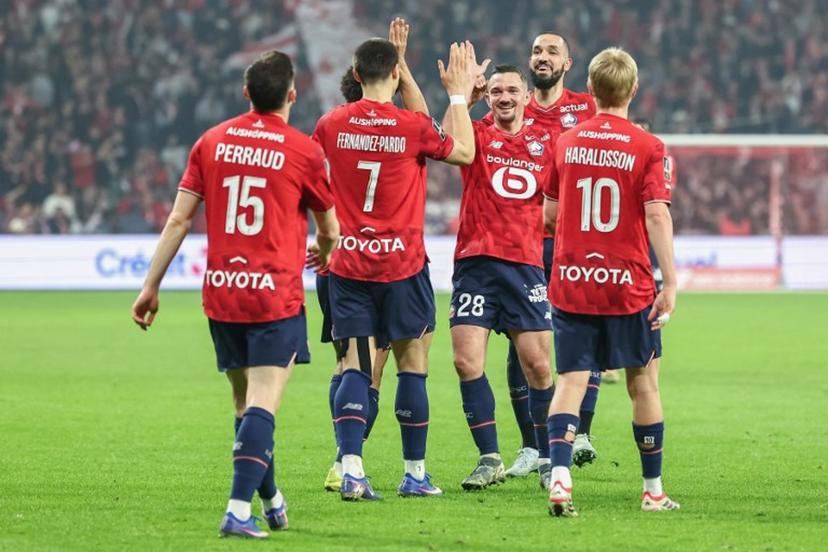 Lille's players French defender #15 Romain Perraud, Belgian forward #07 Matias Fernandez-Pardo, Algerian midfielder #06 Bentaleb Nabil, Icelandic midfielder #10 Hakon Arnar Haraldsson, Algerian midfielder #06 Nabil Bentaleb  celebrate after scoring the team's first goal during the French L1 football match between Lille OSC and FC Lorient at the Stade Pierre-Mauroy in Villeneuve-d'Ascq, northern France on March 8, 2026.  Sameer Al-DOUMY / AFP