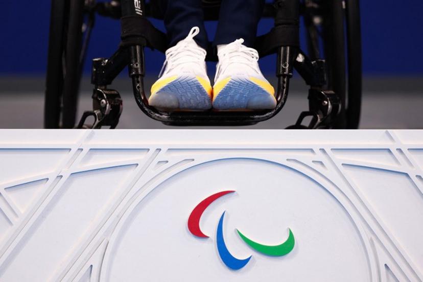 Gold medalist Poland's Kamil Otowski celebrates on the podium of the men's S1 100m backstroke swimming event during the Paris 2024 Paralympic Games at The Paris La Defense Arena in Nanterre, west of Paris on August 29, 2024.  Franck FIFE / AFP