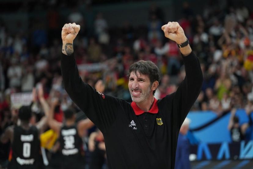Germany's Spanish head coach Alex Mumbru celebrates after winning the FIBA EuroBasket 2025 final basketball match between Turkey and Germany in Riga, Latvia, on September 12, 2025.  Gints Ivuskans / AFP