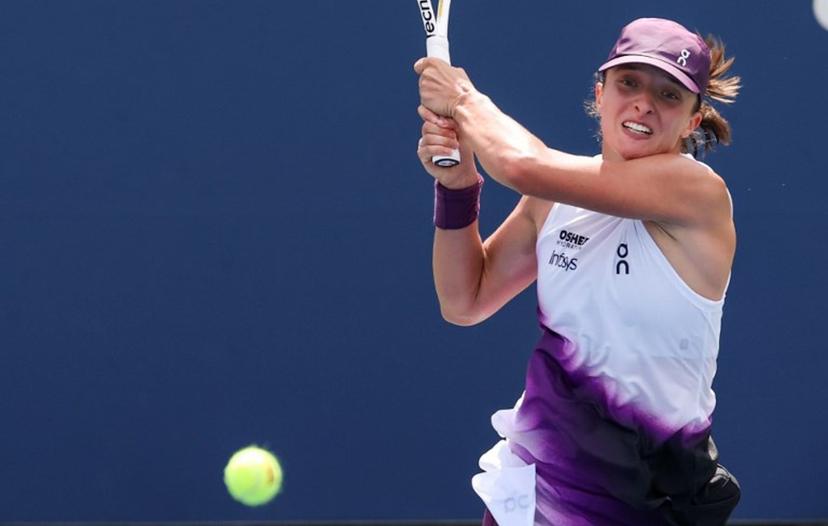 Poland's Iga Swiatek hits a return to Argentina's Nadia Podoroska during their women's singles second round tennis match on day five of the US Open tennis tournament at the USTA Billie Jean King National Tennis Center in New York City on September 3, 2026.  TIMOTHY A. CLARY / AFP