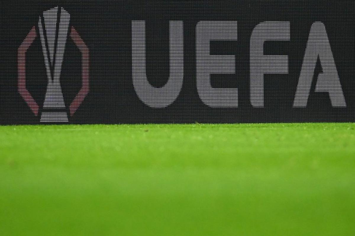 The European Cup logo and the UEFA lettering are visible on an LED wall during the UEFA Europa League first round - day 1 football match between SC Freiburg and FC Basel in Freiburg, southwestern Germany on September 24, 2025.  Silas STEIN / AFP