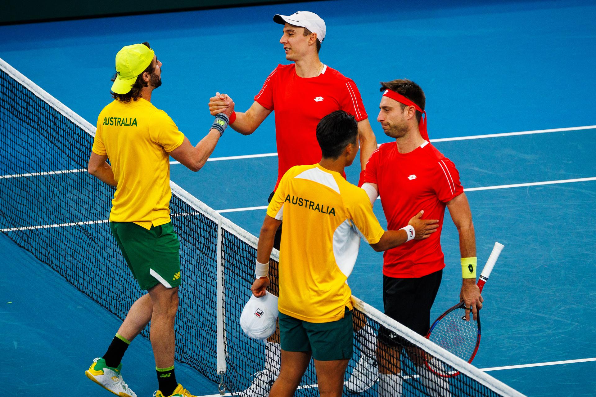 Australian Jordan Thompson, Belgian Joran Vliegen, Australian Rinky Hijikata, Belgian Sander Gille, shake hands after and a a tennis match between Belgian Vliegen/Gille and Australian Hijikata/Thompson, during the qualifier of the Davis Cup, Sunday 14 September 2025, in Sydney, Australia. Belgium and Australia will compete this weekend in the second round of the Davis Cup qualifiers. BELGA PHOTO PATRICK HAMILTON