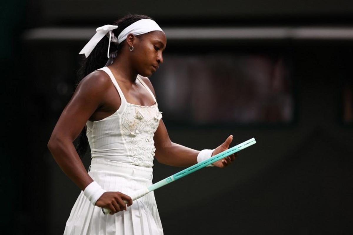 US player Coco Gauff reacts as she plays against Ukraine's Dayana Yastremska during their women's singles first round tennis match on the second day of the 2025 Wimbledon Championships at The All England Lawn Tennis and Croquet Club in Wimbledon, southwest London, on July 1, 2025.  HENRY NICHOLLS / AFP