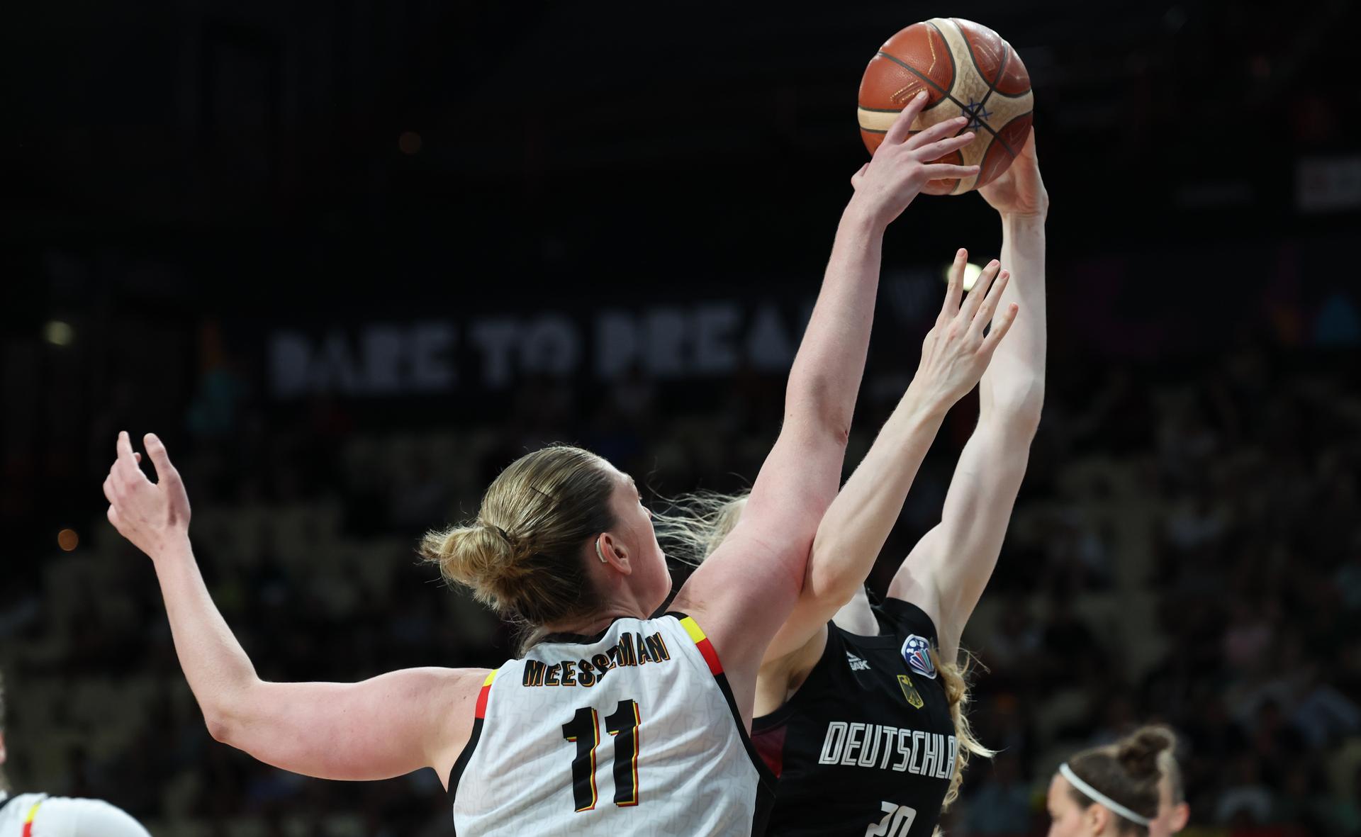 Belgium's Emma Meesseman and German Frieda Buhner fight for the ball during a basketball match between Belgian national team 'the Belgian Cats' and Germany, in the quarterfinals of the FIBA Women's EuroBasket tournament, Wednesday 25 June 2025 in Piraeus, Greece. BELGA PHOTO VIRGINIE LEFOUR