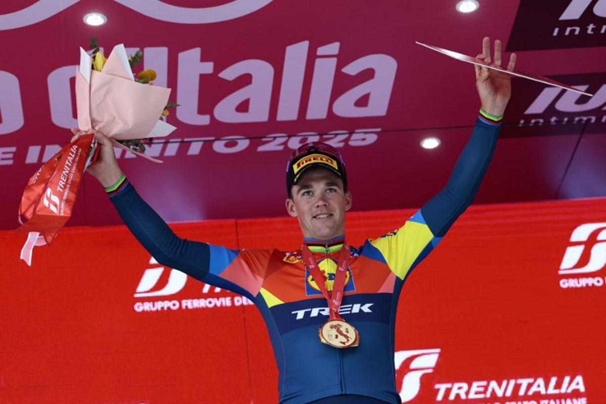 Lidl-Trek's Danish rider Mads Pedersen celebrates on the podium after victory in the 13th stage of the 108th Giro d'Italia cycling race of 180kms from Rovigo to Vicenza on May 23, 2025.  Luca Bettini / AFP
