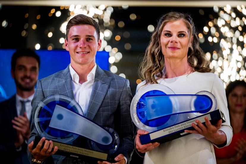 Belgian Remco Evenepoel and Belgian Lotte Kopecky celebrate after winning the 'Kristallen Fiets' (Crystal Bike - Velo de Cristal) award ceremony for the best cyclists of the 2023 cycling season, organized by Flemish newspaper Het Laatste Nieuws, Tuesday 10 October 2023, in Kruisem. BELGA PHOTO JASPER JACOBS