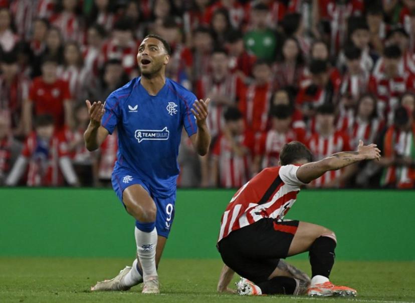 Rangers' Belgian-born Nigerian striker #09 Cyriel Dessers gestures next to Athletic Bilbao's Spanish defender #05 Yerai Alvarez during the UEFA Europa League quarter final second leg football match between Athletic Club Bilbao and Glasgow Rangers, at the San Mames stadium in Bilbao on April 17, 2025.  ANDER GILLENEA / AFP