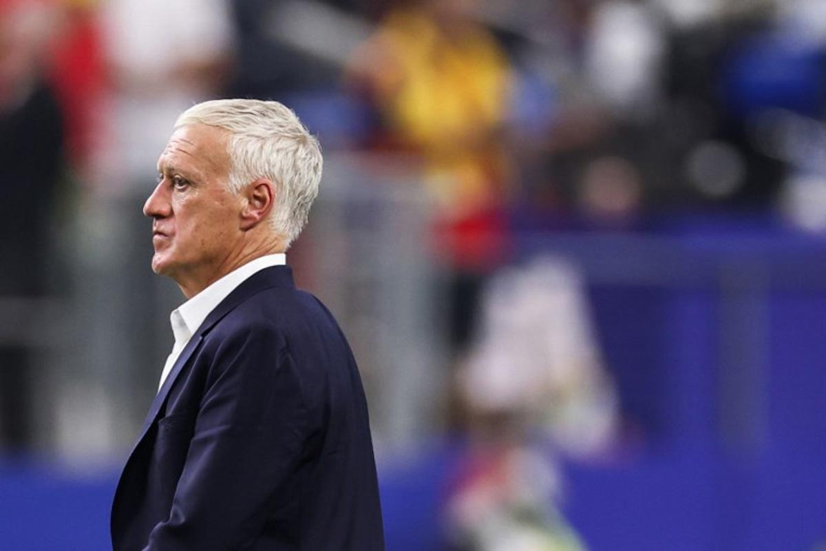 France's head coach Didier Deschamps leaves the pitch after losing the 2026 World Cup football tournament semi-final match between France and Spain at the Dallas Stadium in Arlington on July 14, 2026.   FRANCK FIFE / AFP