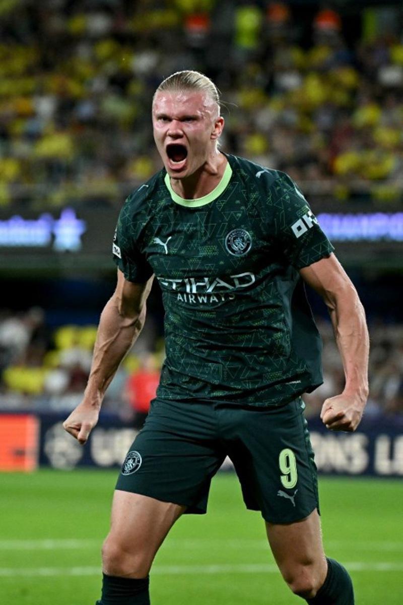 Manchester City's Norwegian forward #09 Erling Braut Haaland celebrates scoring his team's first goal during the UEFA Champions League league phase day 3 football match between Villarreal CF and Manchester City at La Ceramica Stadium in Vila-real on October 21, 2025.  JAVIER SORIANO / AFP
