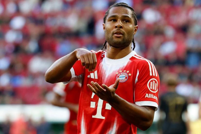 Bayern Munich's German forward #07 Serge Gnabry celebrates scoring the opening goal with his teammates during the German first division Bundesliga football match between FC Augsburg and FC Bayern Munich in Augsburg, southern Germany, on August 30, 2025.  Michaela STACHE / AFP