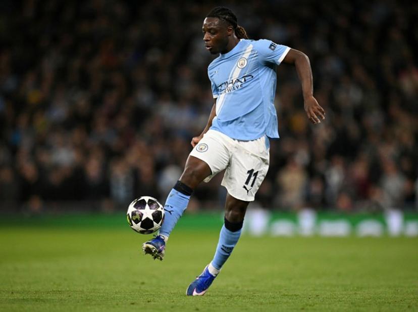 Manchester City's Belgian midfielder #11 Jeremy Doku controls the ball during the UEFA Champions League, round of 16 second leg football match between Manchester City and Real Madrid at the Etihad Stadium in Manchester, north west England, on March 17, 2026.  Oli SCARFF / AFP