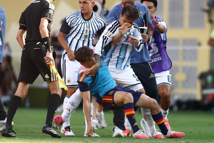 (FILES) Argentina's midfielder #05 Leandro Paredes (top) clashes with Spain's midfielder #09 Gavi during the 2026 World Cup football tournament final match between Spain and Argentina at the New York/New Jersey Stadium in East Rutherford on July 19, 2026. FIFA announced on July 29, 2026 that it had opened proceedings into some Argentina players for their behaviour after losing the World Cup to Spain. A handful of Argentina players and staff confronted their Spanish rivals after the final whistle of the final in New York which Spain won 1-0 after extra time. Argentina players including Nahuel Molina, Thiago Almada and Leandro Paredes, as well as Argentinian official Roberto Ayala, were involved in the incidents, as was Spain's Pablo Martin Paez Gavira. CHARLY TRIBALLEAU / AFP
