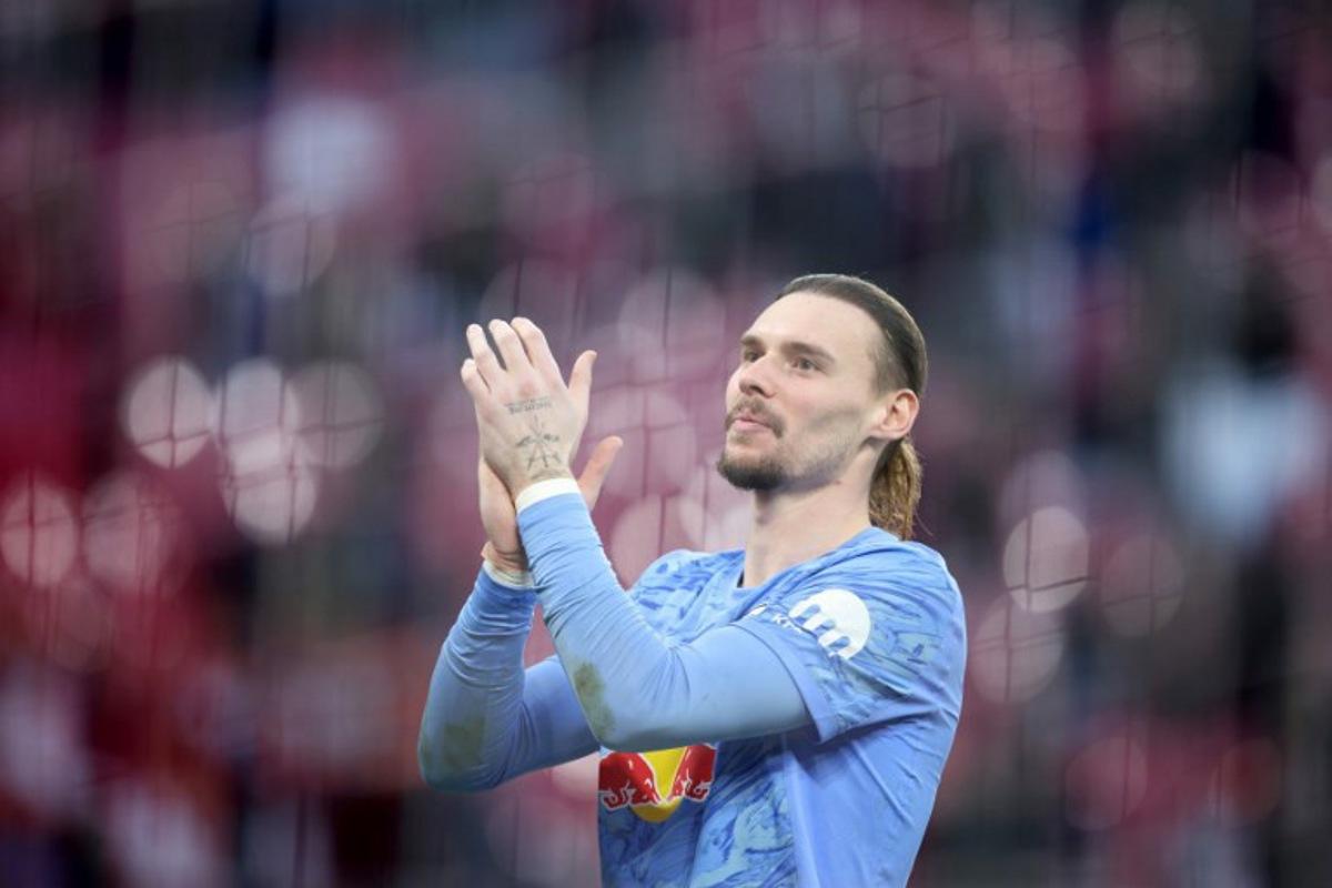 Leipzig's Belgian goalkeeper #26 Maarten Vandevoordt celebrates after the Bundesliga football match between RB Leipzig and Augsburg in Leipzig, eastern Germany, on March 7, 2026.  Ronny HARTMANN / AFP