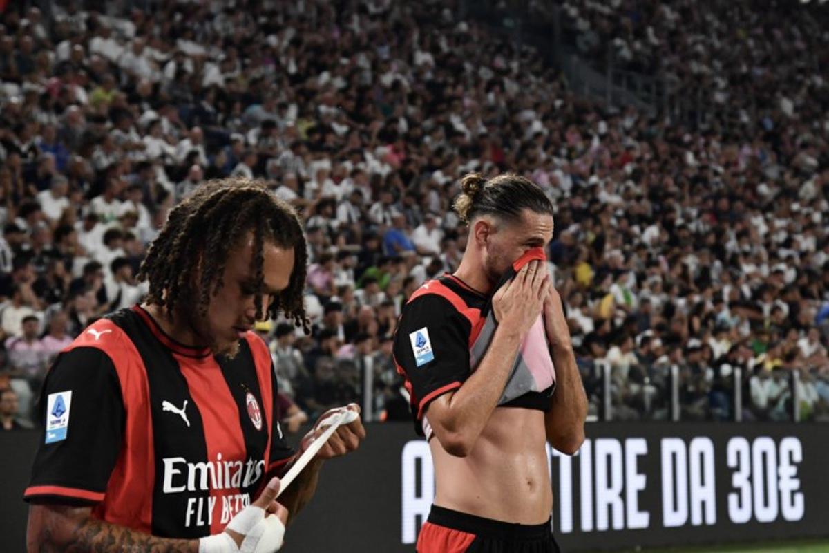 AC Milan's Belgian midfielder #22 Diego Moreira (L) and AC Milan's French midfielder #12 Adrien Rabiot react after being substitued during the Italian Serie A football match between Juventus and AC Milan at the Allianz Stadium in Turin on September 6, 2026.  Isabella BONOTTO / AFP