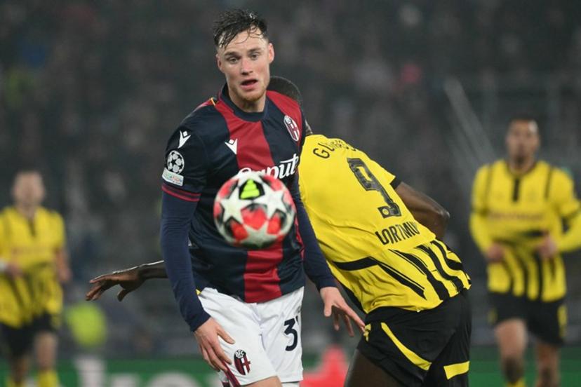 Bologna's Dutch defender #31 Sam Beukema fights for the ball with Dortmund's Guinean forward #09 Serhou Guirassy during the UEFA Champions League football match between Bologna and Borussia Dortmund at the Renato Dall'Ara stadium in Bologna on January 21, 2025.  Alberto PIZZOLI / AFP