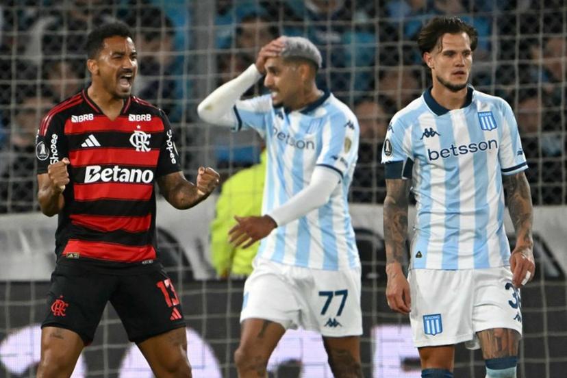 Flamengo's defender #13 Danilo celebrates next to Racing's midfielder #36 Bruno Zuculini during the Copa Libertadores semifinal second leg football match between Argentina's Racing and Brazil's Flamengo at the Presidente Juan Domingo Peron - El Cilindro stadium in Avellaneda, Buenos Aires province, on October 29, 2025.  Luis ROBAYO / AFP