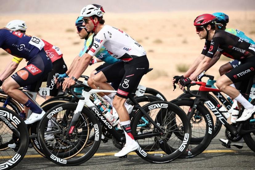 UAE Team Emirates cycling team's Swiss Jan Christen rides during the first stage of the AlUla Tour cycling race, a 158 km race started and finished in the Saudi desert city of AlUla, on January 27, 2026.  Anne-Christine POUJOULAT / AFP