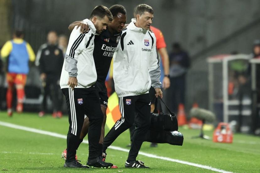 Lyon's Belgian forward #17 Lois Openda leaves the pitch due to an injury during the French L1 football match between RC Lens and Olympique Lyonnais (OL) at the Stade Bollaert-Delelis in Lens, northern France, on October 9, 2026.  Sameer AL-DOUMY / AFP