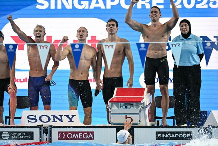 Neutral Athlete's team Neutral Athlete swimmer Andrei Minakov, Neutral Athlete swimmer Miron Lifintsev, Neutral Athlete swimmer Kirill Prigoda and Neutral Athlete swimmer Egor Kornev react after winning the men's 4x100m medley relay swimming event during the 2025 World Aquatics Championships in Singapore on August 3, 2025.   Manan VATSYAYANA / AFP