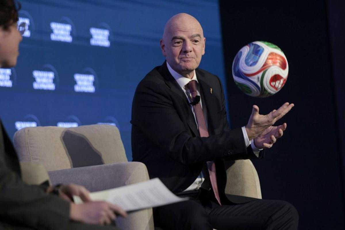 FIFA President Gianni Infantino juggles a foootball while speaking during the 2026 Semafor World Economy conference in Washington, DC, on April 15, 2026.  Kent NISHIMURA / AFP