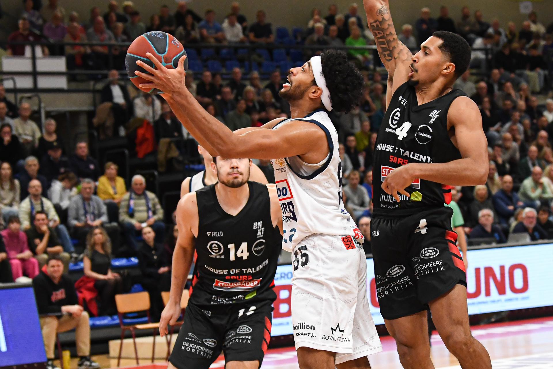 Limburg's Jalen Blackmon and Kortrijk's Noel Coleman pictured in action during a basketball match between Limburg United and House of Talents Spurs Kortrijk, Friday 05 December 2025 in Hasselt, on day 10 of the 'BNXT League' Belgian/ Dutch first division basket championship. BELGA PHOTO JILL DELSAUX