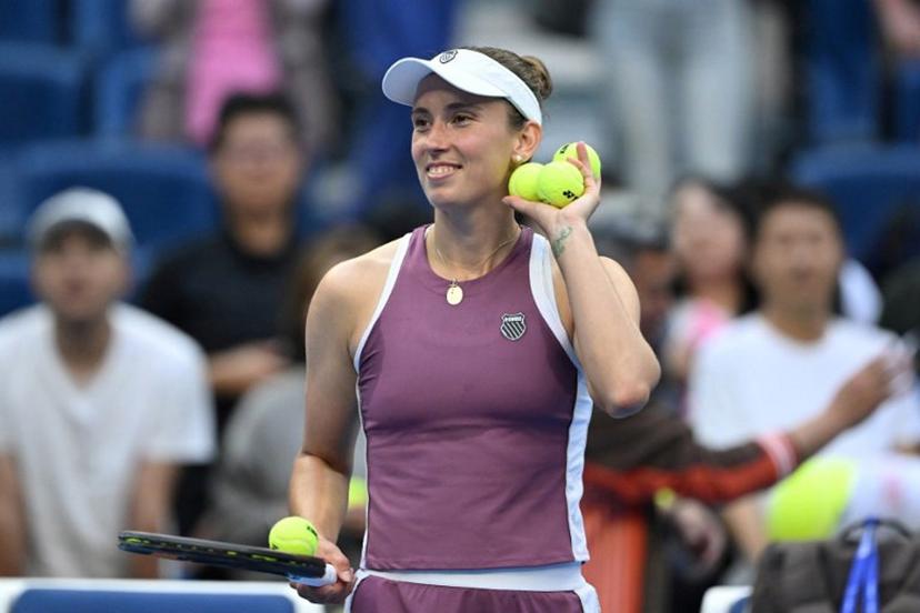 Belgium's Elise Mertens celebrates after winning her women's singles match against USA's Coco Gauff at the China Open tennis tournament in Beijing on October 7, 2026.   Adek BERRY / AFP