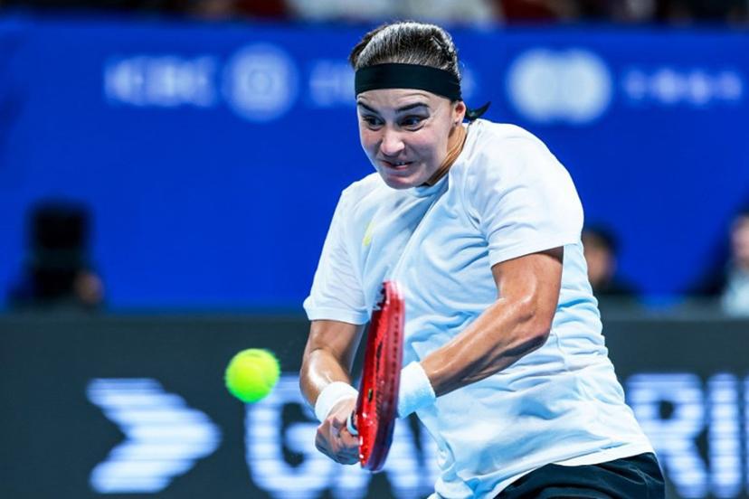 Ukraine's Anhelina Kalinina hits a return to Italy's Tyra Grant during their women's singles semi-final match at the Billie Jean King Cup tennis tournament in Shenzhen, in China's southern Guangdong province on September 26, 2026.  CN-STR / AFP