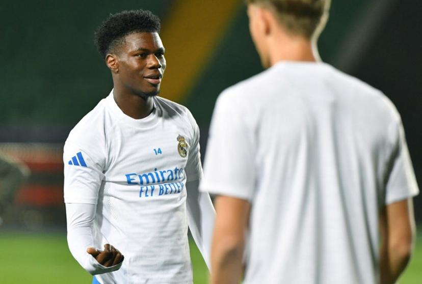 Real Madrid's French midfielder #14 Aurelien Tchouameni (L) takes part in a training session on the eve of the team's UEFA Champions League first round day 2 football match between Real Madrid (ESP) and Kairat Almaty (KAZ), at Almaty Ortalyk stadion in Almaty on September 29, 2025.  VYACHESLAV OSELEDKO / AFP