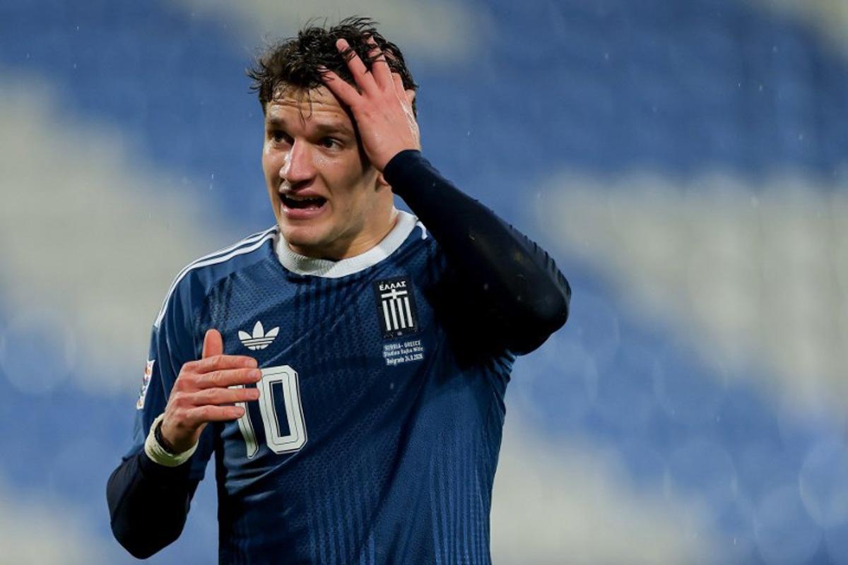 Greece's forward #10 Christos Tzolis reacts after scoring his team's first goal during the UEFA Nations League phase group A2 football match between Serbia and Greece at the Rajko Mitic Stadium in Belgrade on September 24, 2026.  Pedja Milosavljevic / AFP