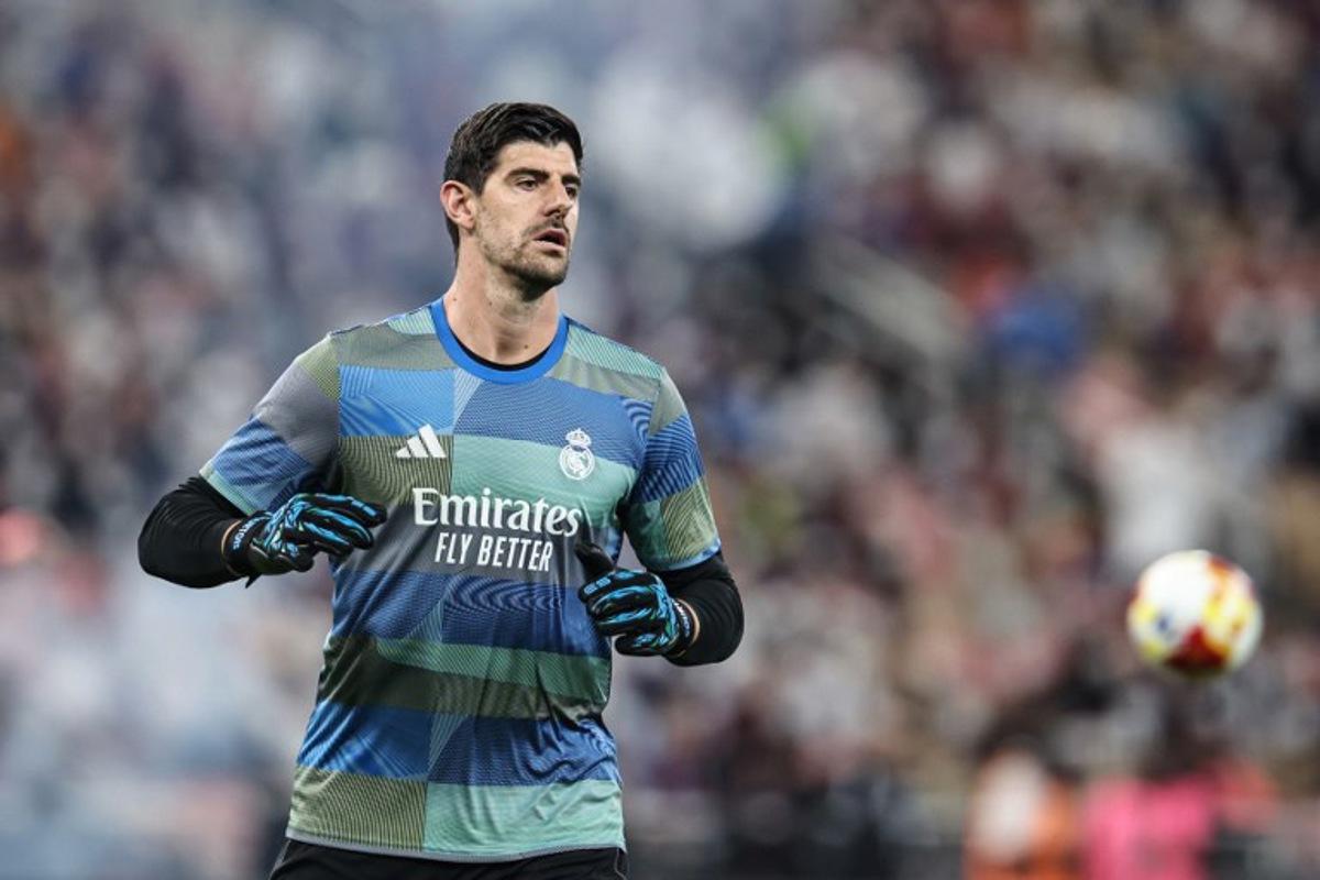 Real Madrid's Belgian goalkeeper #01 Thibaut Courtois warms up prior to the start of the Spanish Super Cup final football match between FC Barcelona and Real Madrid at the King Abdullah Stadium in Jeddah on January 11, 2026.  Fadel SENNA / AFP