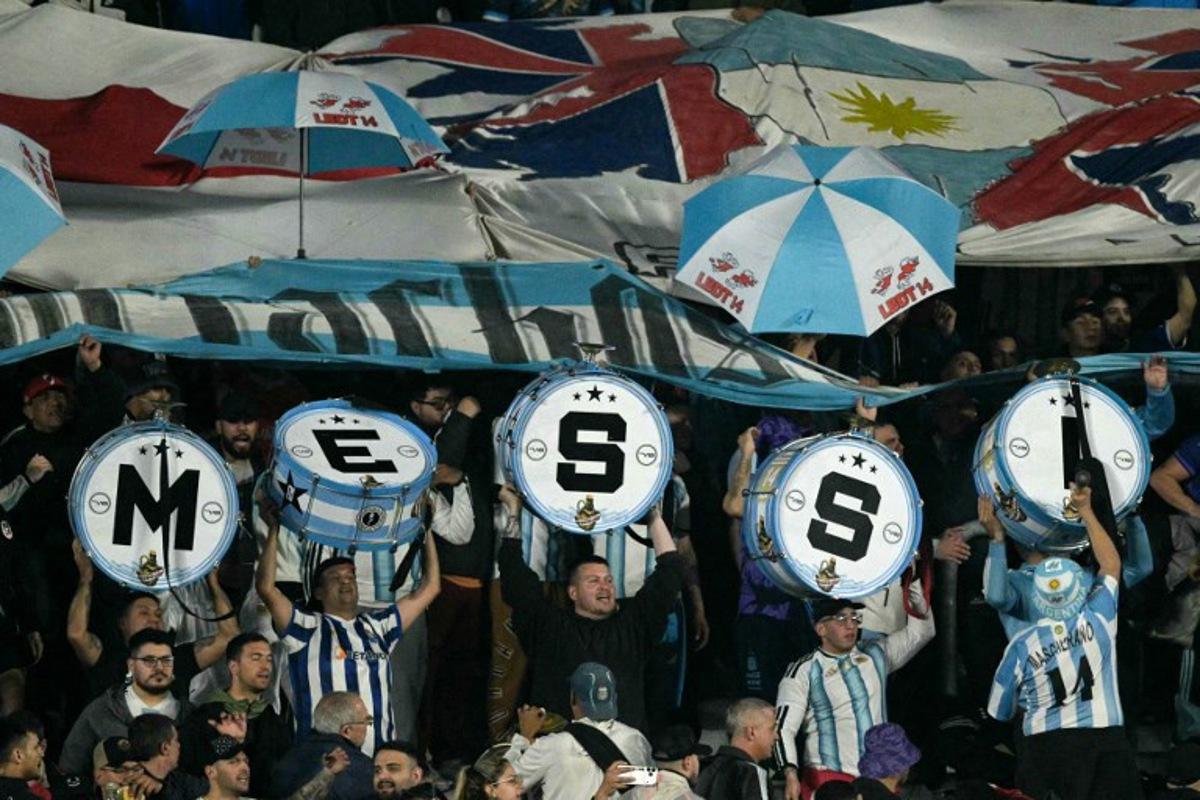 Argentine fans show drums spelling out "Messi" during the international friendly football match between Argentina and Burkina Faso at the Mas Monumental stadium in Buenos Aires on October 3, 2026.  JUAN MABROMATA / AFP