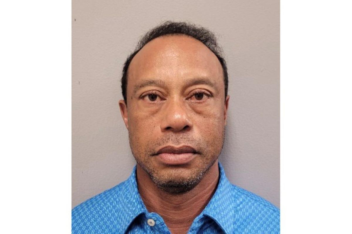 This handout mugshot released on March 27, 2026 provided by the Martin County Sheriff's Office shows the mugshot of US golfer Tiger Woods, 50, who was arrested in Jupiter Island, Florida on March 27, 2026. The golf icon was arrested and charged with driving under the influence after a rollover crash near his Florida home, authorities said. HANDOUT / Florida Department of Corrections / AFP