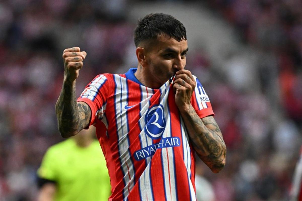 Atletico Madrid's Argentine forward #10 Angel Correa celebrates scoring his team's fourth goal during the Spanish league football match between Club Atletico de Madrid and Real Betis at Metropolitano Stadium in Madrid on May 18, 2025.  JAVIER SORIANO / AFP