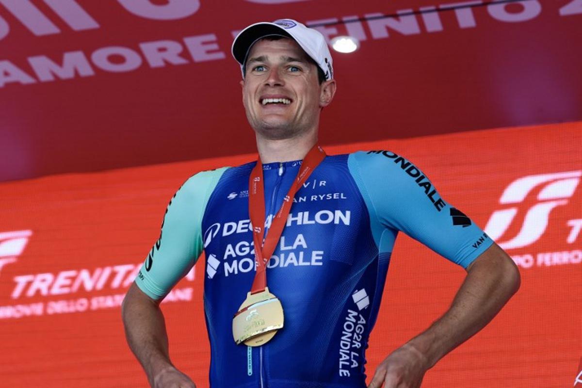 Decathlon AG2R La Mondiale Team's French rider Nicolas Prodhomme celebrates on the podium after victory in the 19th stage of the 108th Giro d'Italia cycling race of 166kms from Biella to Champoluc on May 30, 2025.  Luca Bettini / AFP