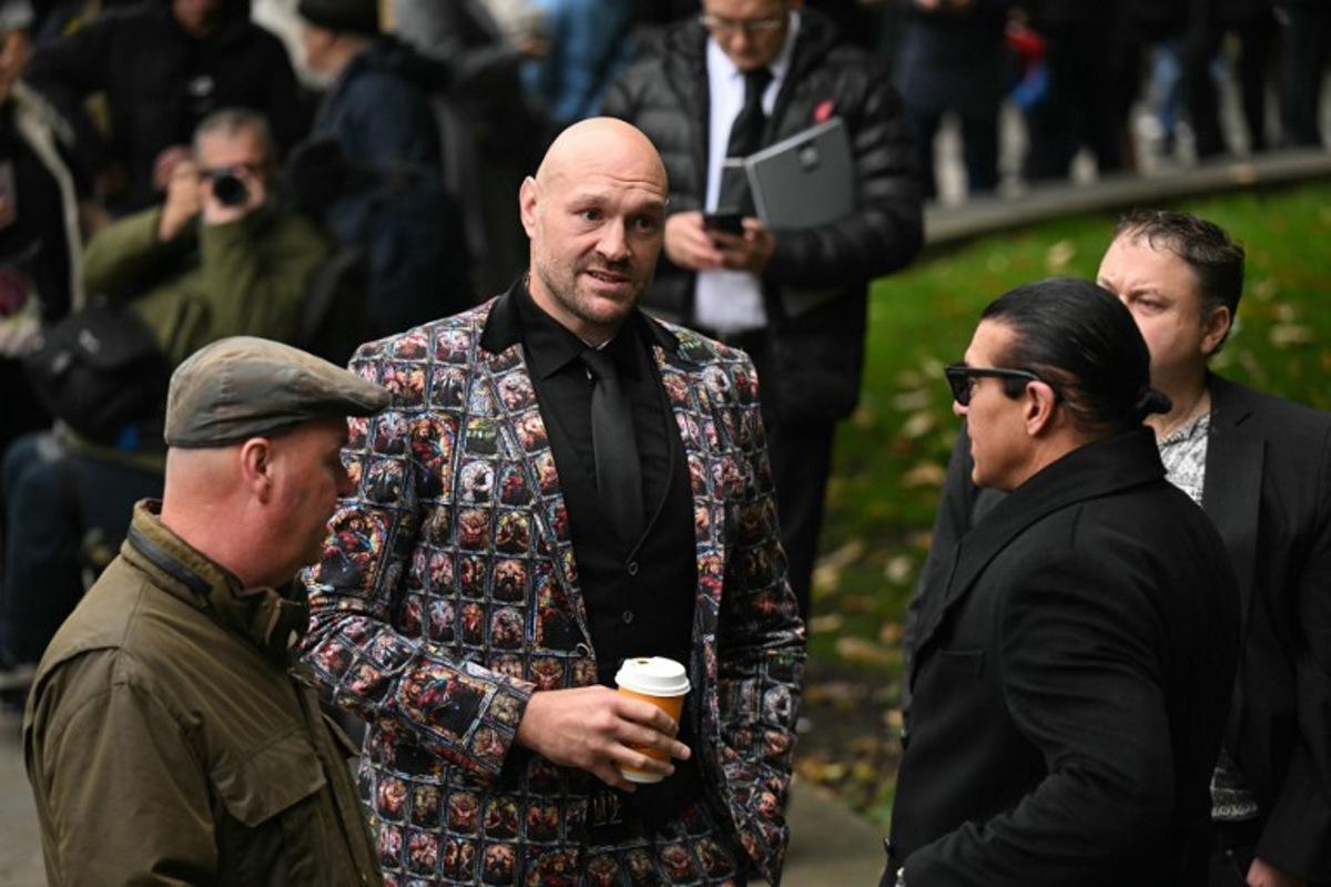 British boxer Tyson Fury arrives to attend the funeral of late British boxer Ricky Hatton at Manchester Cathedral, north-west England on October 10, 2025. Ricky Hatton's family said Monday they feel an "immeasurable" sense of loss after the death of the British former boxing world champion at the age of 46. Hatton was found dead at his home in Hyde, Greater Manchester.  Oli SCARFF / AFP