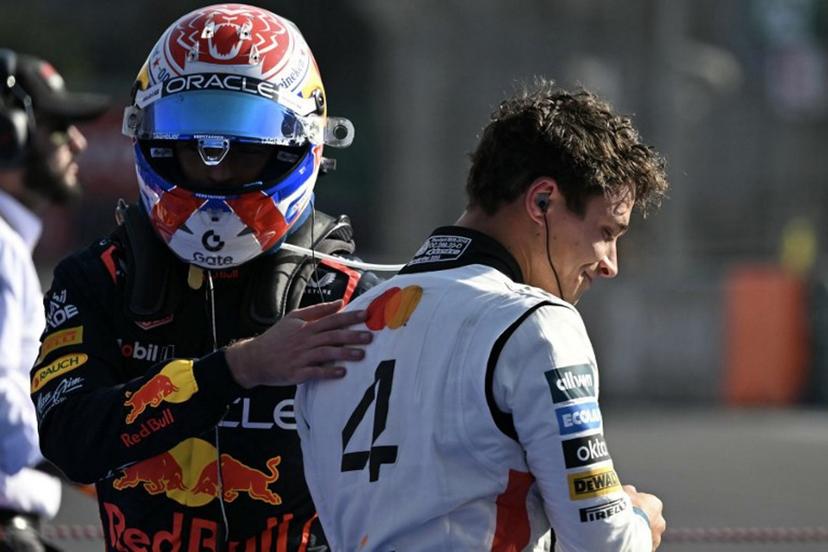 McLaren's British driver Lando Norris (R) celebrates winning with the third-placed Red Bull Racing's Dutch driver Max Verstappen (L) after the Mexico City Formula One Grand Prix at the Hermanos Rodriguez racetrack in Mexico City on October 26, 2025.  Yuri CORTEZ / AFP