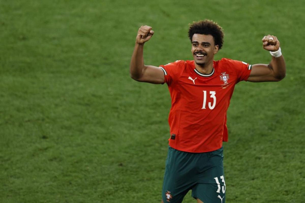 Portugal's midfielder #13 Renato Veiga celebrates after winning the UEFA Nations League final football match between Portugal and Spain in Munich, southern Germany on June 8, 2025.  Alexandra BEIER / AFP