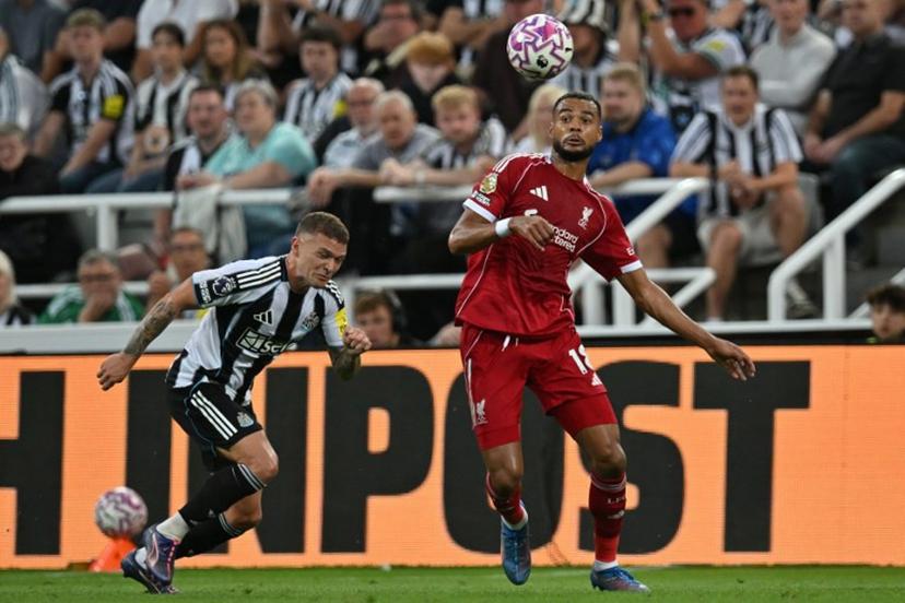 Liverpool's Dutch striker #18 Cody Gakpo (R) controls the ball during the English Premier League football match between Newcastle United and Liverpool at St James' Park in Newcastle-upon-Tyne, north east England on August 25, 2025.  ANDY BUCHANAN / AFP