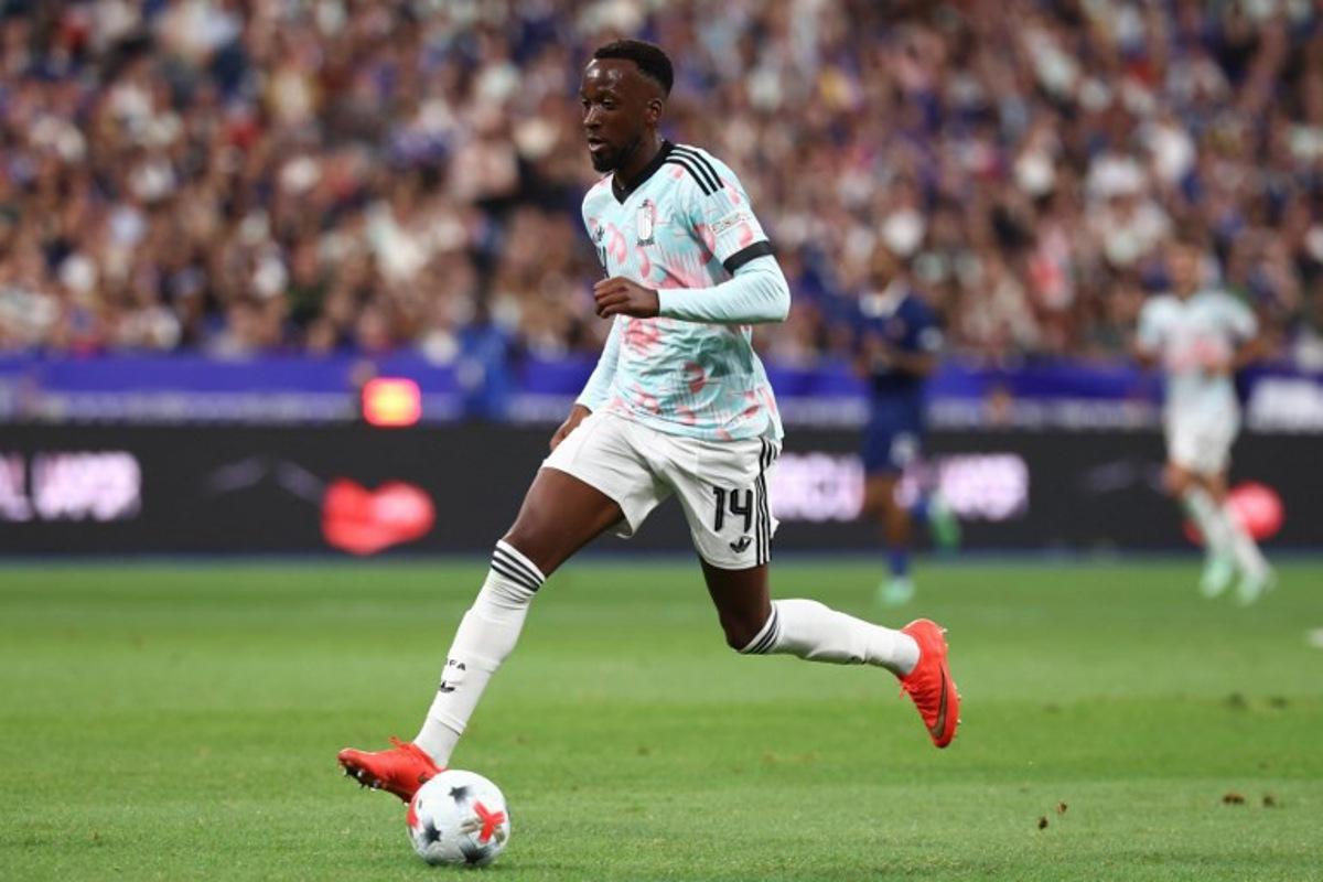 Belgium's forward #14 Dodi Lukebakio runs with the ball prior to scoring the opening goal during the UEFA Nations League Group A1 football match between France and Belgium at the Stade de France in Saint-Denis, north of Paris, on October 5, 2026.  FRANCK FIFE / AFP