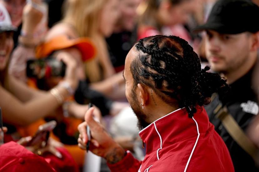 Ferrari's British driver Lewis Hamilton meets with fans as he arrives ahead of the Formula One Australian Grand Prix at the Albert Park Circuit in Melbourne on March 16, 2025.  Saeed KHAN / AFP
