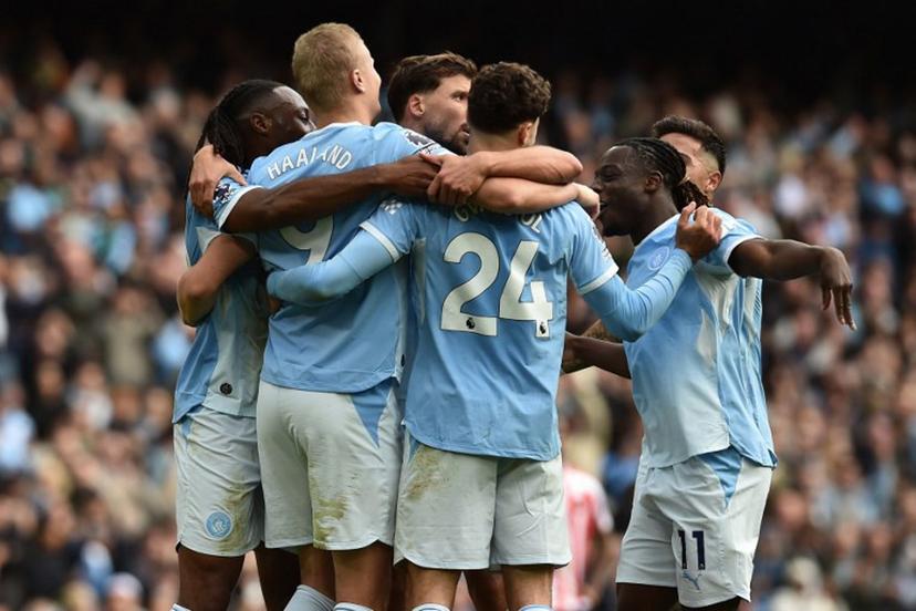 Manchester City's Norwegian striker #09 Erling Haaland (2L) celebrates with teammates after scoring their fifth goal during the English Premier League football match between Manchester City and Sunderland at the Etihad Stadium in Manchester, north west England, on September 20, 2026.  PETER POWELL / AFP