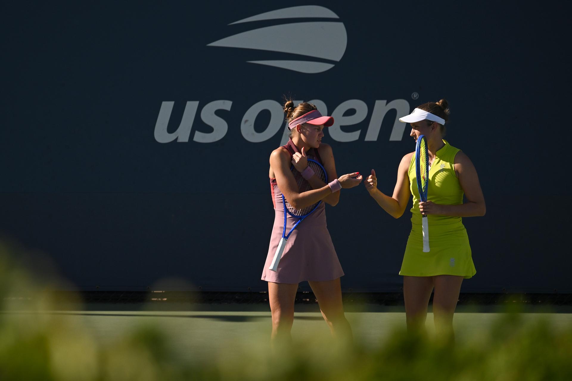 Belgian Elise Mertens (yellow) and Veronika Kudermetova (pink) pictured during a tennis match against US pair Brantmeier-Hamilton, in the second round of the women's doubles of the 2025 US Open Grand Slam tennis tournament in New York City, USA, Saturday 30 August 2025. BELGA PHOTO TONY BEHAR