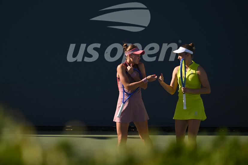 Belgian Elise Mertens (yellow) and Veronika Kudermetova (pink) pictured during a tennis match against US pair Brantmeier-Hamilton, in the second round of the women's doubles of the 2025 US Open Grand Slam tennis tournament in New York City, USA, Saturday 30 August 2025. BELGA PHOTO TONY BEHAR