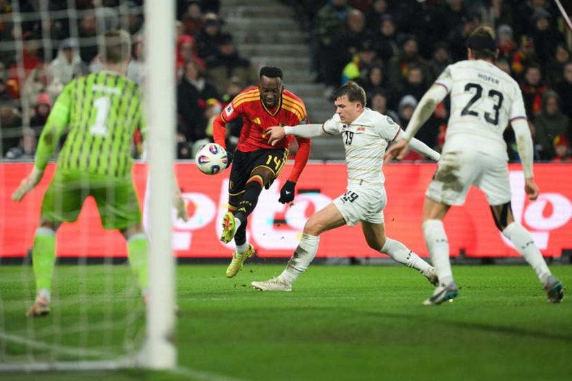 Belgium's forward #14 Dodi Lukebakio shoots during the FIFA World Cup 2026 Group J European qualification football match between Belgium and Liechtenstein at the Maurice-Dufrasne stadium, in Liege, on November 18, 2025.   NICOLAS TUCAT / AFP