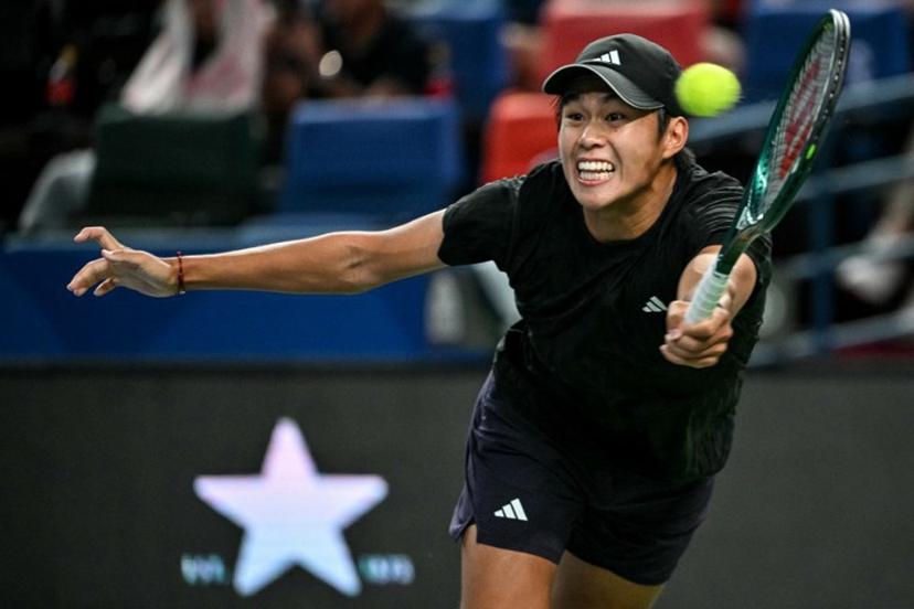United States's Learner Tien hits a return to Russia's Daniil Medvedev during their men's singles match at the Shanghai Masters tennis tournament in Shanghai on October 8, 2025.  HECTOR RETAMAL / AFP