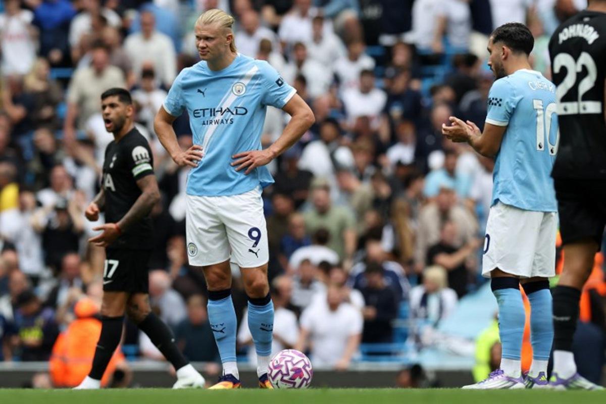 Manchester City's Norwegian striker #09 Erling Haaland reacts after the team conceded a second goal during the English Premier League football match between Manchester City and Tottenham Hotspur at the Etihad Stadium in Manchester, north west England, on August 23, 2025.  Darren Staples / AFP