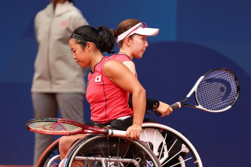 Japan's Manami Tanaka (R) and Yui Kamiji  (L) compete during the women's wheelchair doubles tennis semi-final match against China's Ziying Wang and China's Luoyao Guo on the Court Philippe Chatrier at the Roland-Garros Stadium during the Paris 2024 Paralympic Games, on September 3, 2024.  ALAIN JOCARD / AFP