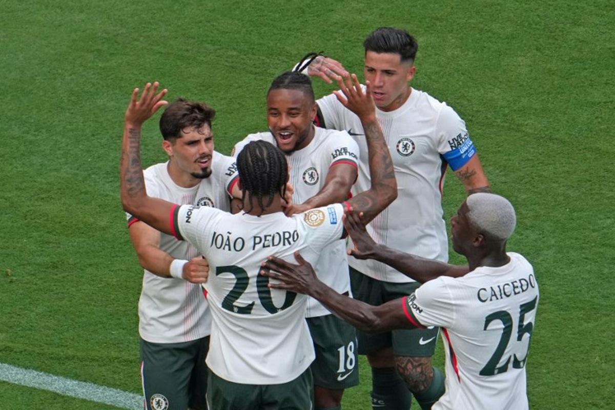 Chelsea's Brazilian forward #20 Joao Pedro celebrates with his teammates Chelsea's Argentinian midfielder #08 Enzo Fernandez (2-R), Chelsea's French striker #18 Christopher Nkunku, Chelsea's Portuguese midfielder #07 Pedro Neto (L), and Chelsea's Ecuadorian midfielder #25 Moises Caicedo after scoring his team's first goal during the FIFA Club World Cup 2025 semifinal football match between Brazil's Fluminense and England's Chelsea at the MetLife stadium in East Rutherford, New Jersey on July 8, 2025.  TIMOTHY A. CLARY / AFP