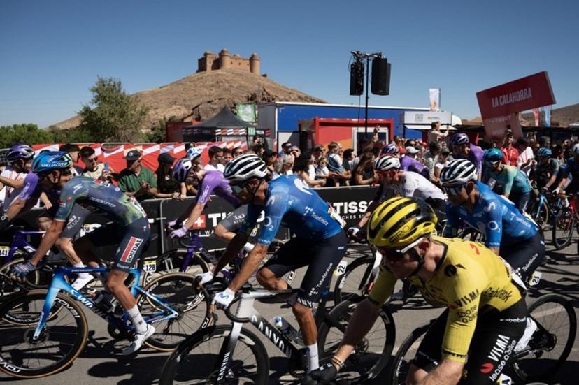 Cyclists ride at the start of the 20th stage of the Vuelta a Espana 2026 cycling tour, a 186,8 km race between La Calahorra and Collado del Alguacil, on September 12, 2026.   JORGE GUERRERO / AFP